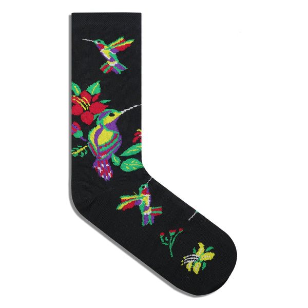 Colibrí entre flores