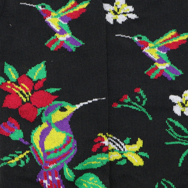Colibrí entre flores